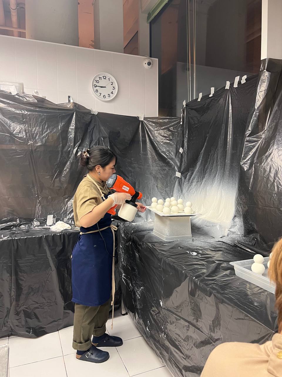 Mess from cocoa butter spraying